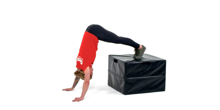 image of athlete doing box handstand